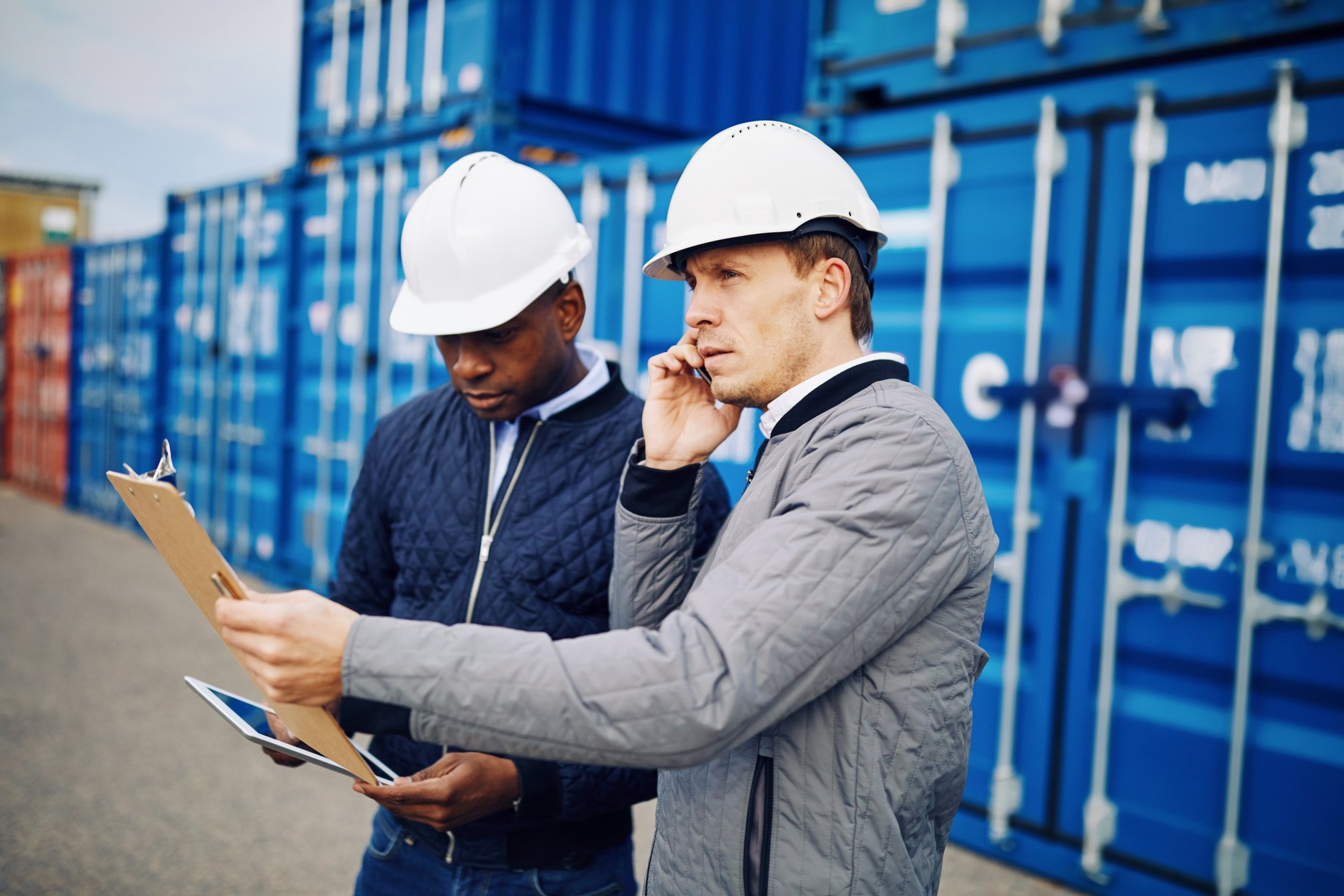 Engineers Working in a Large Commercial Freight Shipping Yard