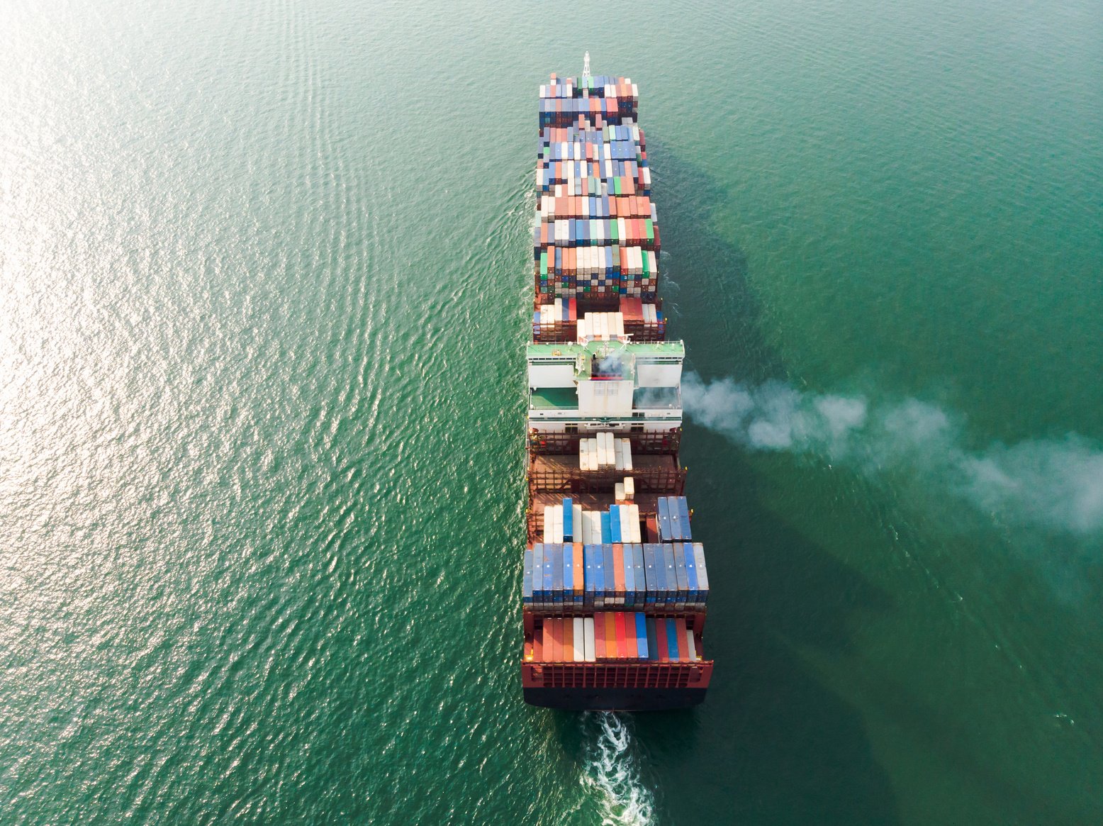 Business International trade and Container logistics export-import harbor to the International port / Shipping Containers - Bird's-eye view from drone.